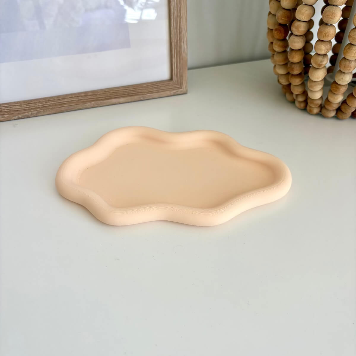 Cloud Tray 3d printed styled on a white table with a picture and wooden base lamp